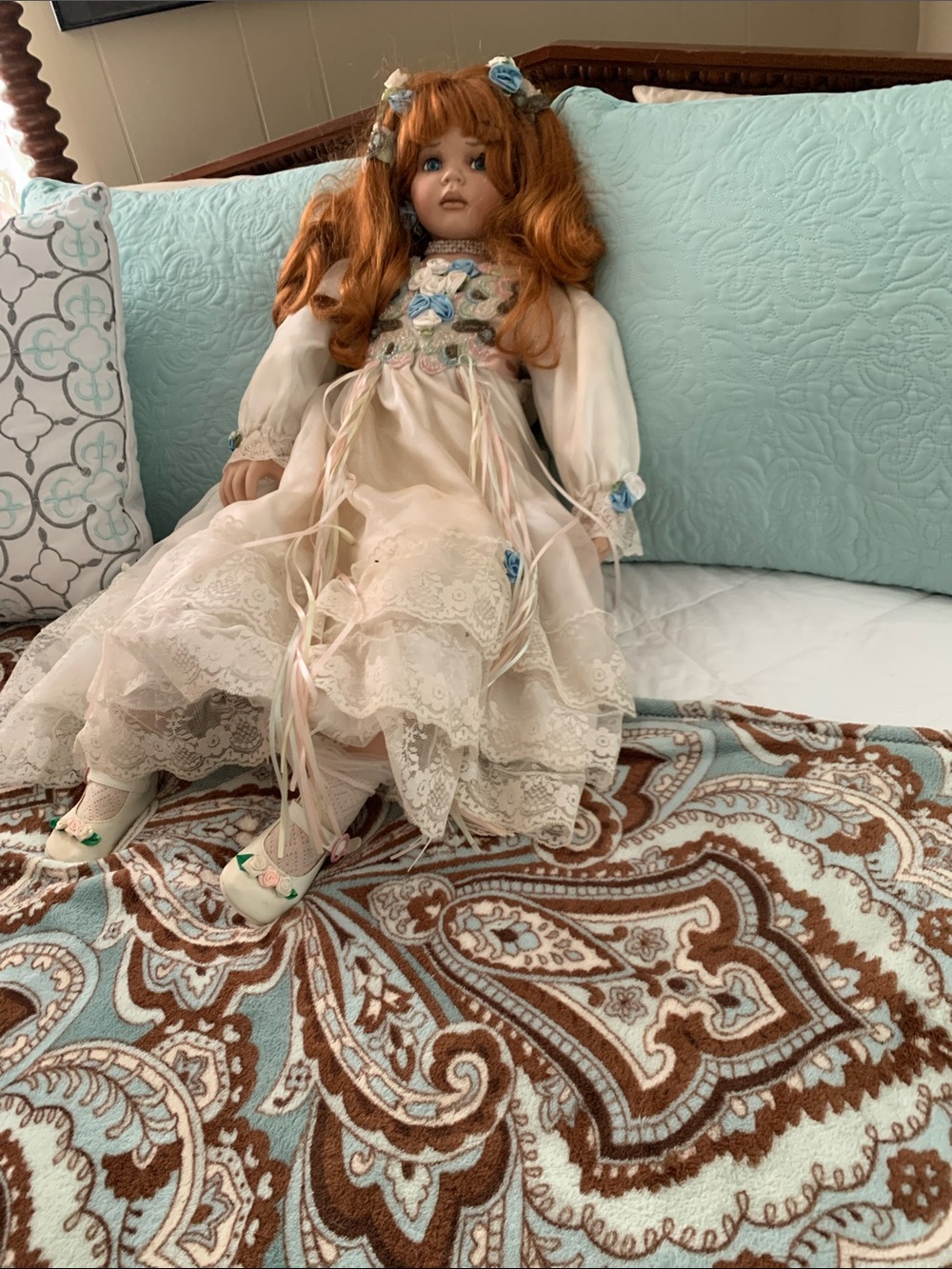 Collectible Porcelain Doll in Cream Dress with Blue Accents